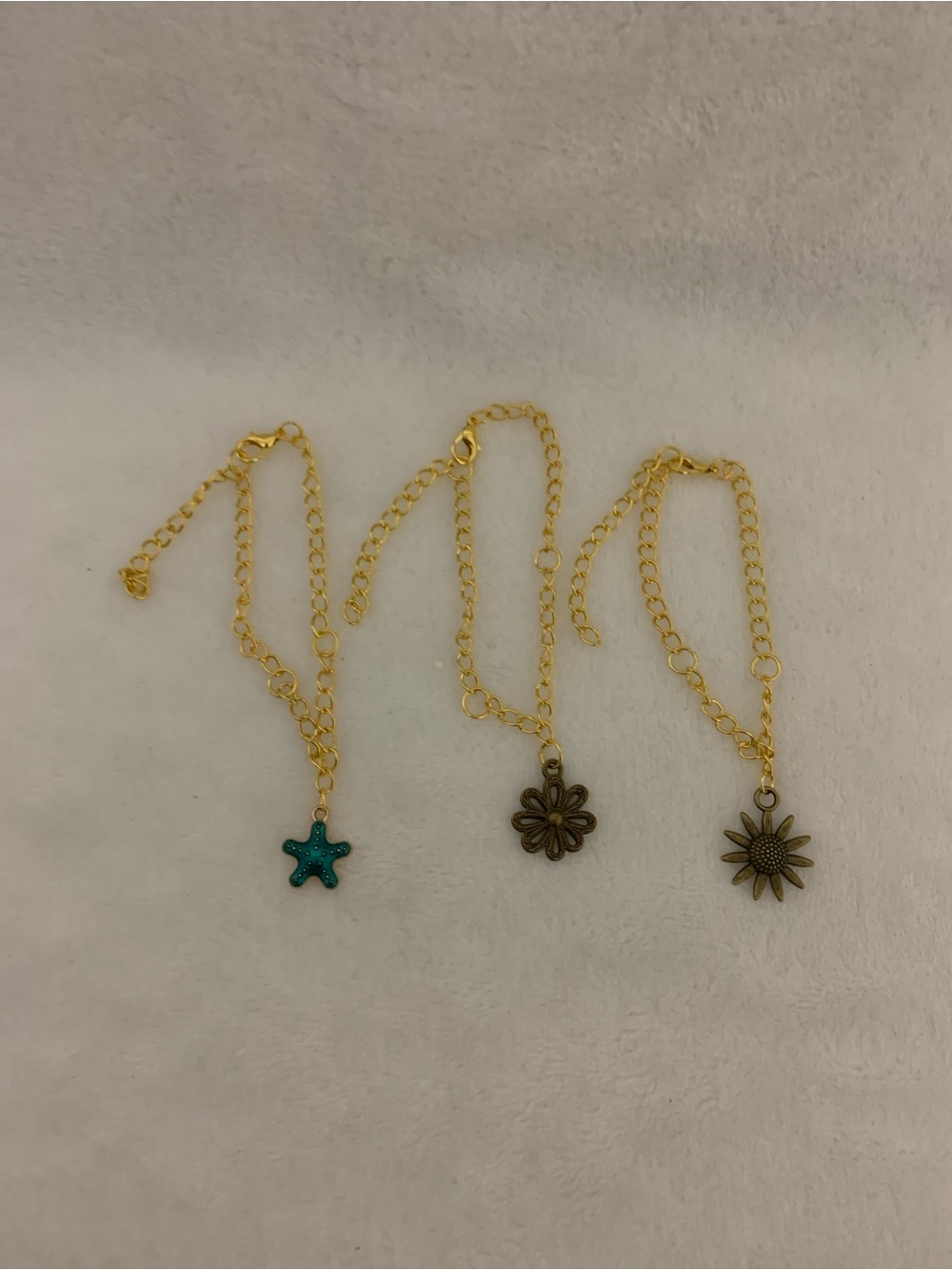 Gold-Plated Charm Bracelet with Turquoise Star and Floral Charms